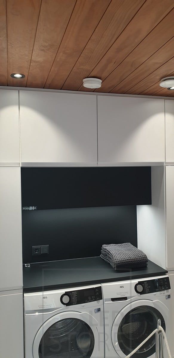 Spotlights in front of the cabinets and indirect LED strip lighting the level